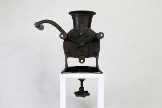 Acehnese Coffee grinder on a light background