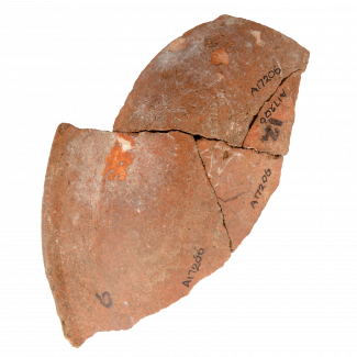Various pottery sherds that have been pieced back together, on a white background