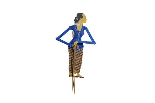 A leather puppet depicting a person wearing a blue top and brown striped skirt