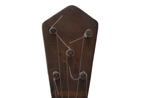 Detail of a small guitar-like instrument