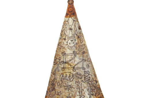 A triangular amulet with various images etched into its surface