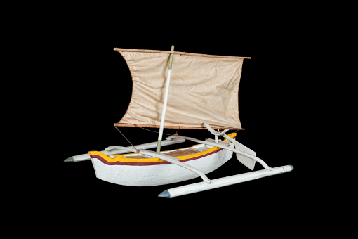 A type of sailing boat on a black background