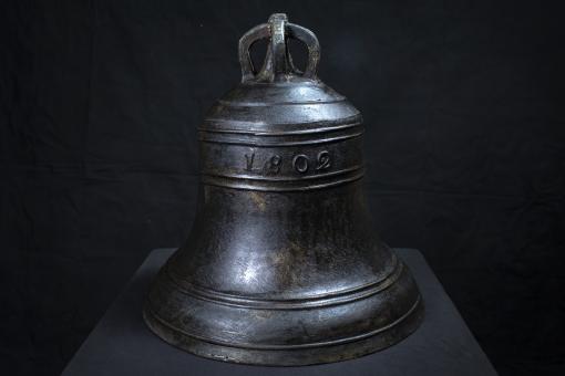 Forbes bell against a dark background