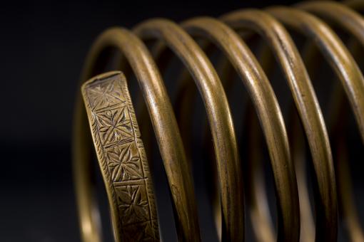 Image of an Iyok bracelet on a dark background